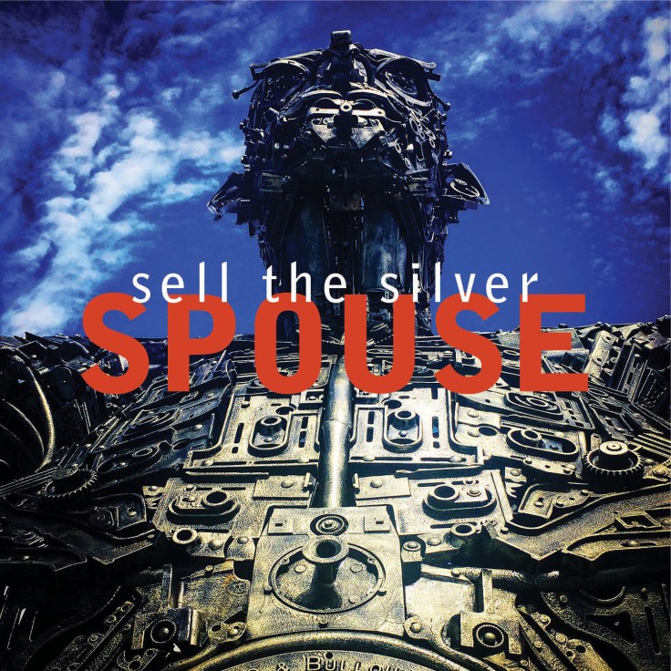 SPOUSE: Sell the Silver cover with giant metal sculpture and blue sky